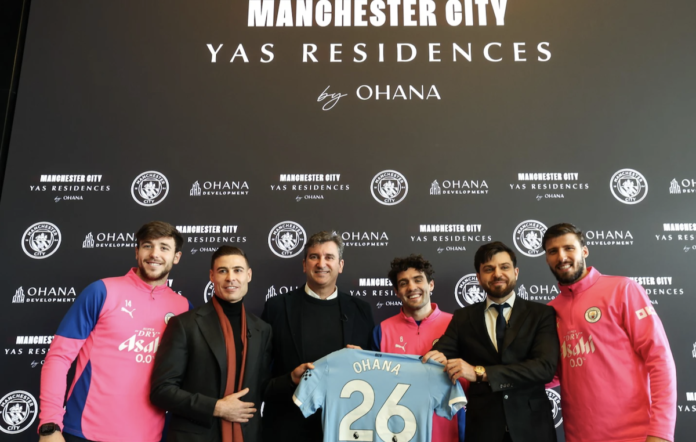 Manchester City players and executives with the Ohana Development team | Rental Living News